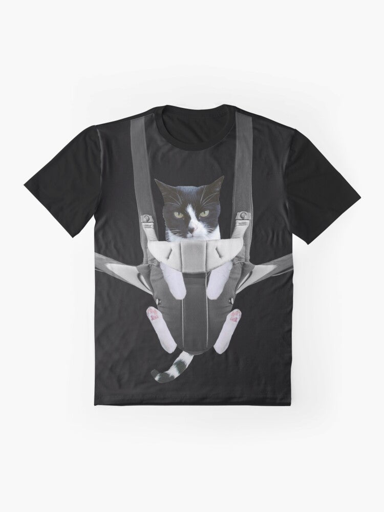 A graphic t-shirt design featuring a cute cat in a baby carrier - Flat lay