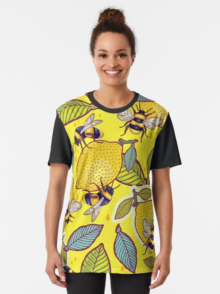 Graphic t-shirt design featuring a yellow lemon, bee, and garden elements - Women