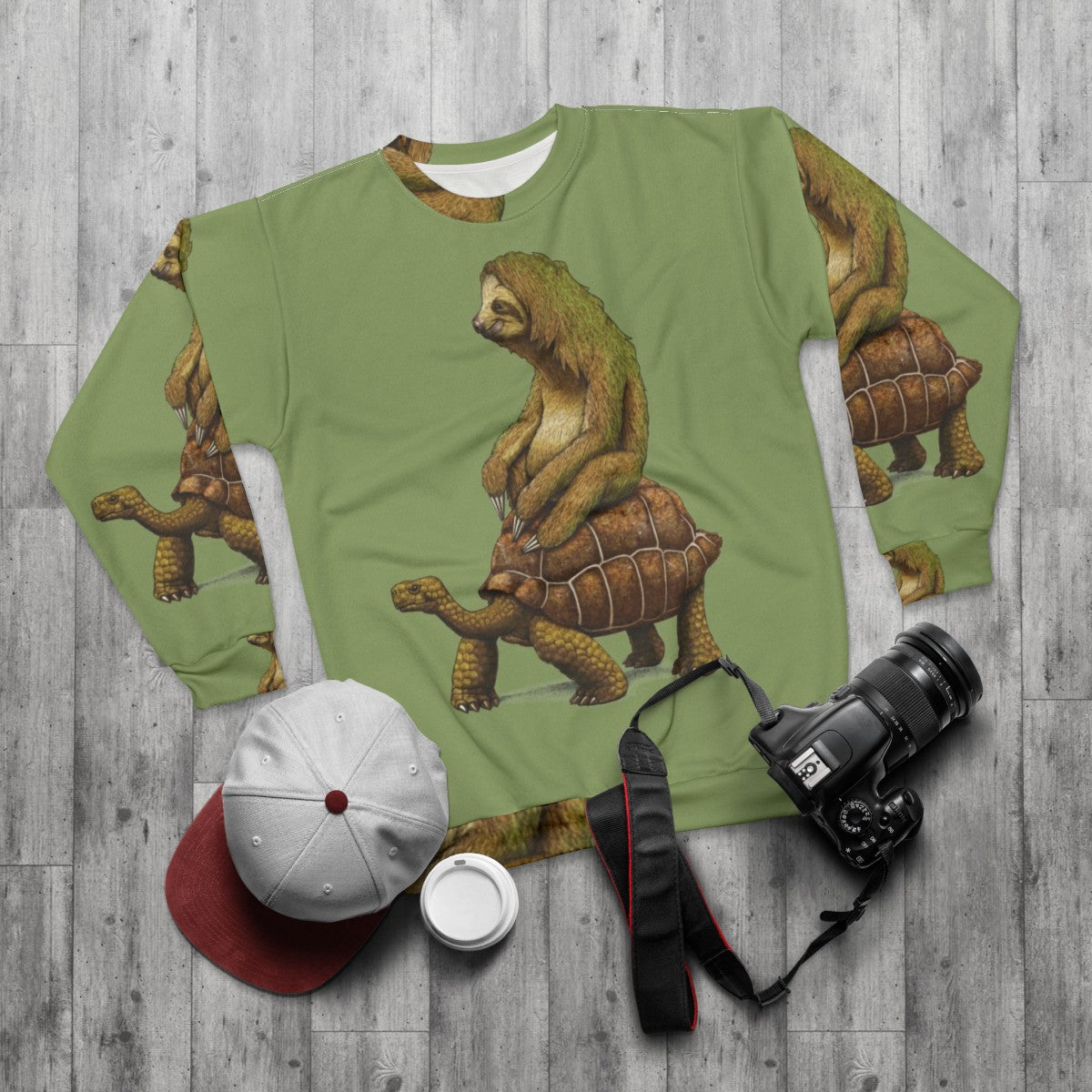 "Sloth and turtle graphic on a cozy sweatshirt" - flat lay