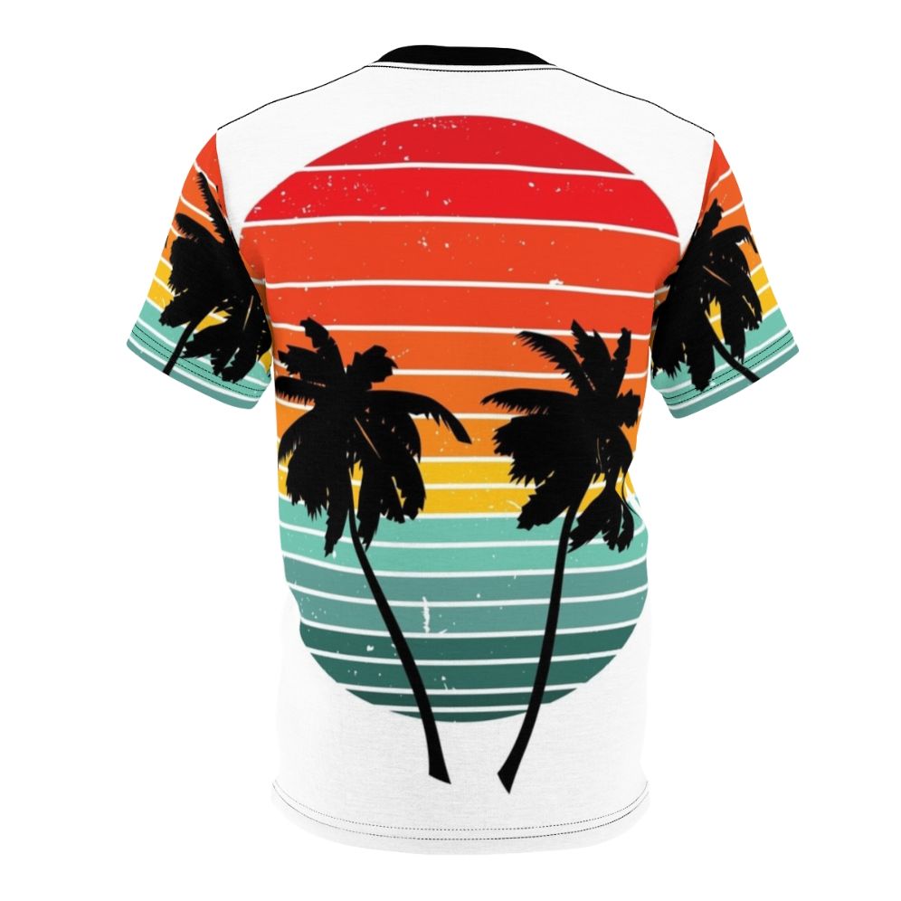 Person wearing a black t-shirt with a vivid tropical palm tree and sunrise silhouette design - Back