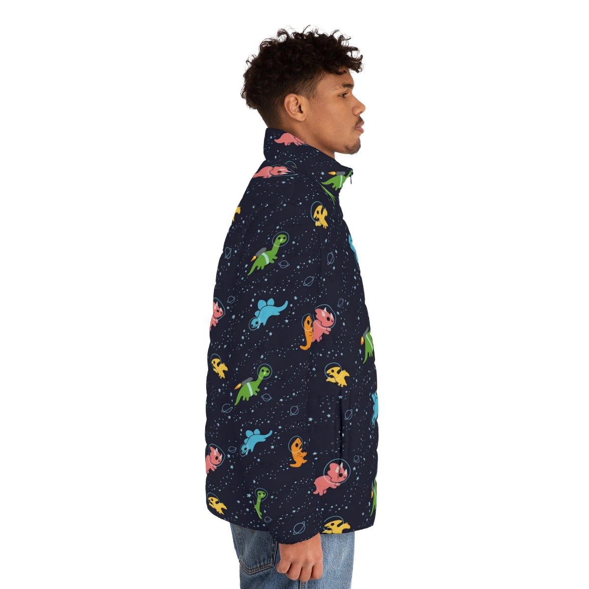 A puffer jacket featuring a whimsical pattern of dinosaurs floating in a galaxy of stars and planets. - men side right