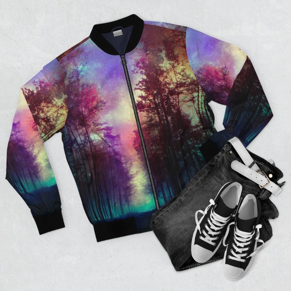 Magical forest bomber jacket with a colorful landscape design featuring trees, sky, and stars. - Flat lay