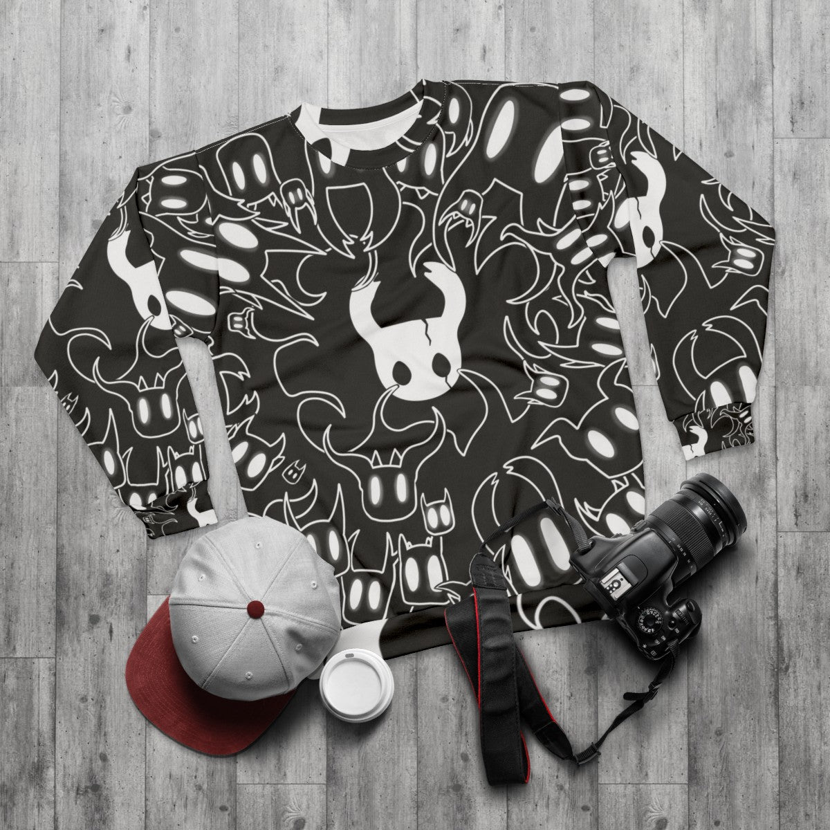 Hollow Knight doodle inspired sweatshirt with indie game artwork - flat lay