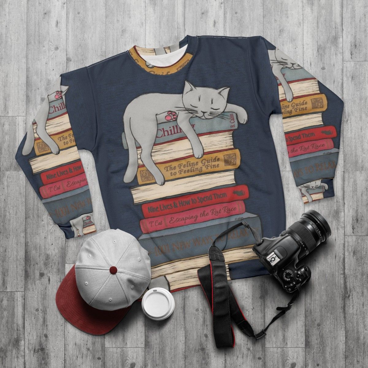 Cozy gray sweatshirt with "How to Chill Like a Cat" design - flat lay