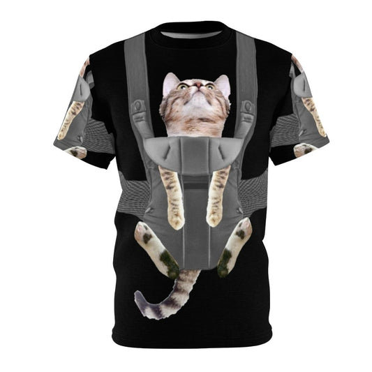 Tabby cat sitting in a baby carrier on a t-shirt