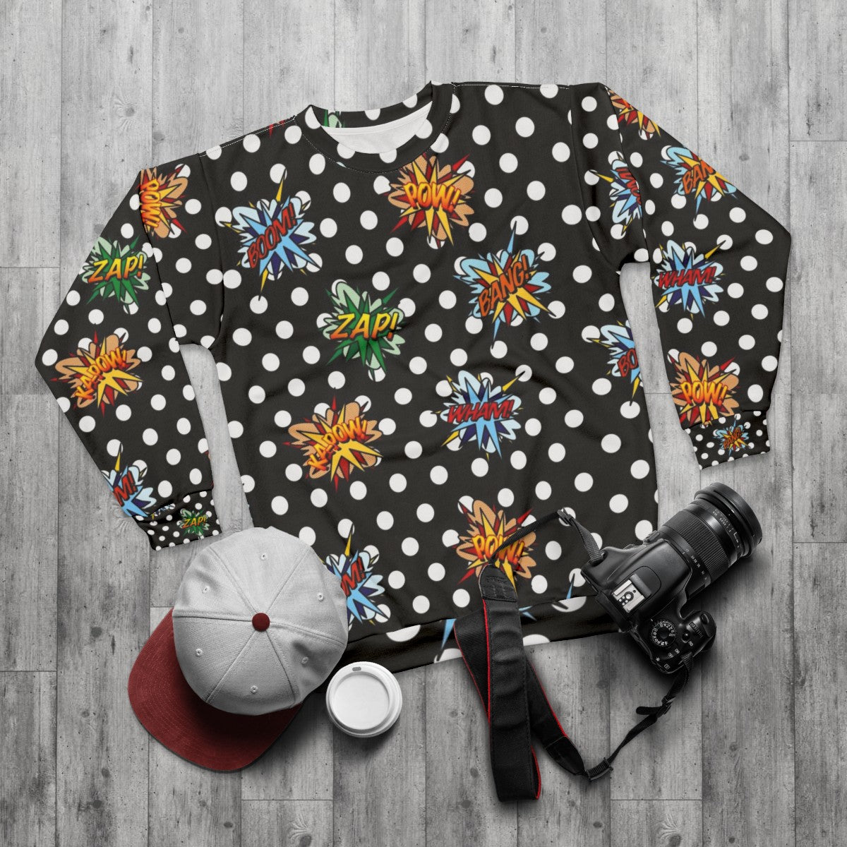 Pop art comic book inspired sweatshirt with modern graphic design - flat lay