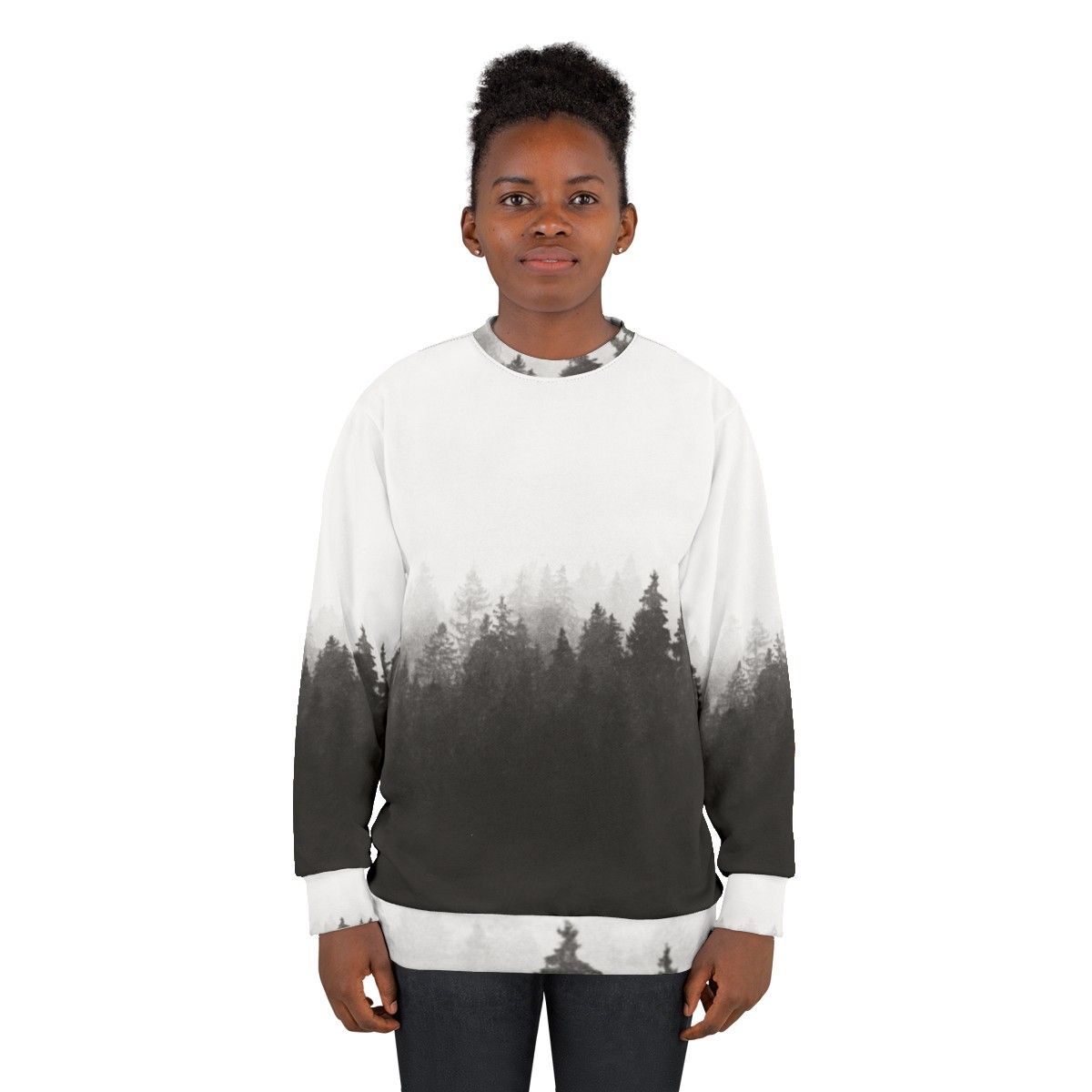 A person hiking in a foggy, forested landscape wearing a nature-inspired sweatshirt - women