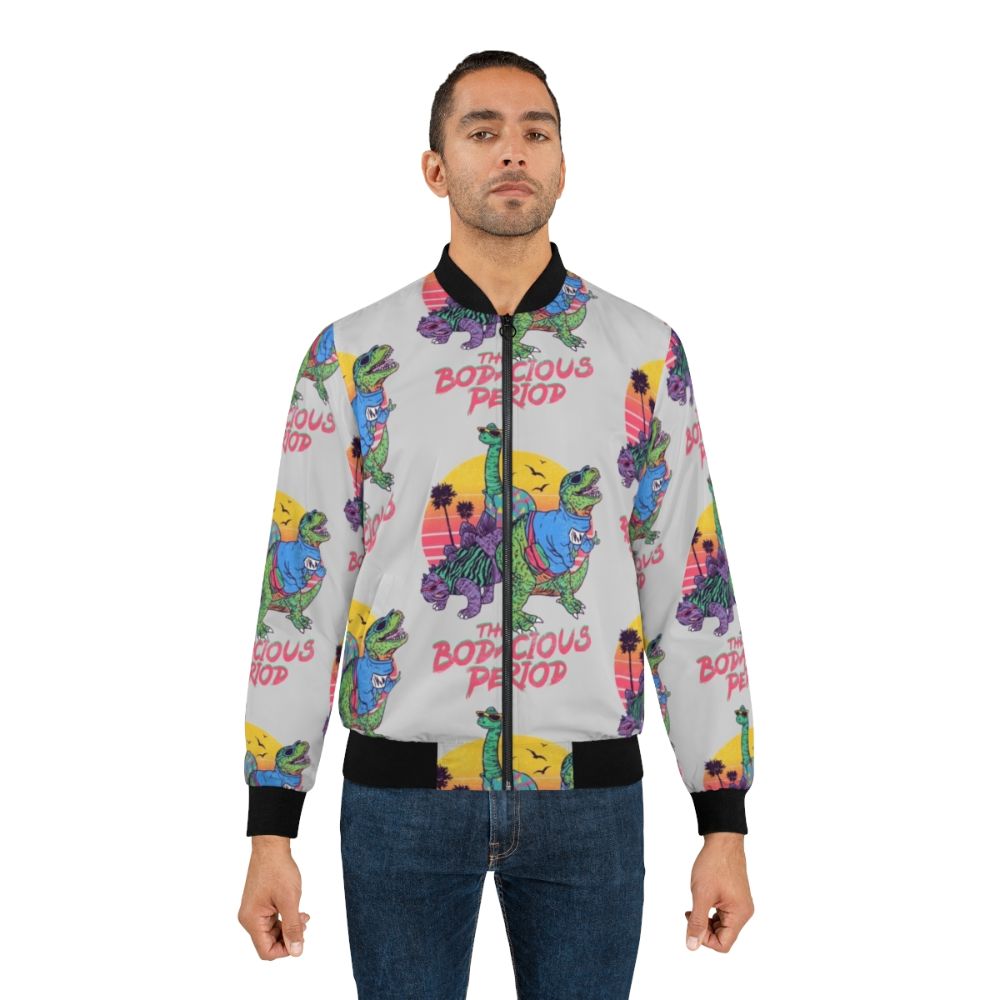 A dinosaur-themed 80s retro bomber jacket with a bold, colorful design. - Lifestyle