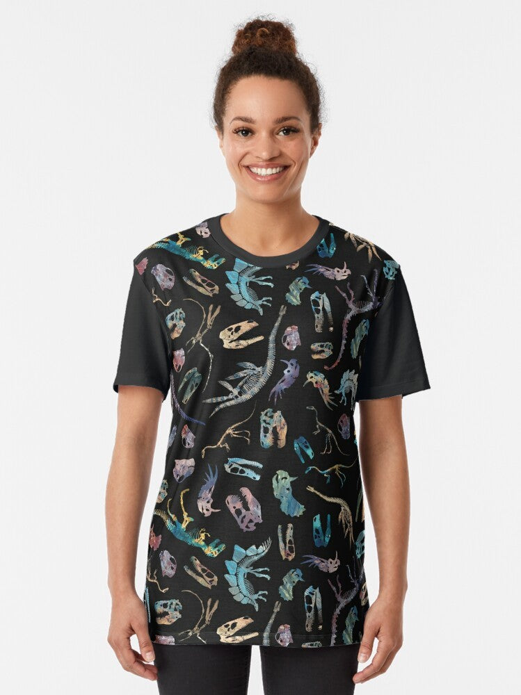 Minimalist graphic t-shirt design featuring dinosaur fossil bones and skull silhouette in a contemporary, scientific style. - Women