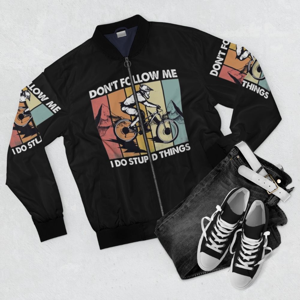 Downhill mountain bike bomber jacket with "Don't Follow Me, I Do Stupid Things" text - Flat lay