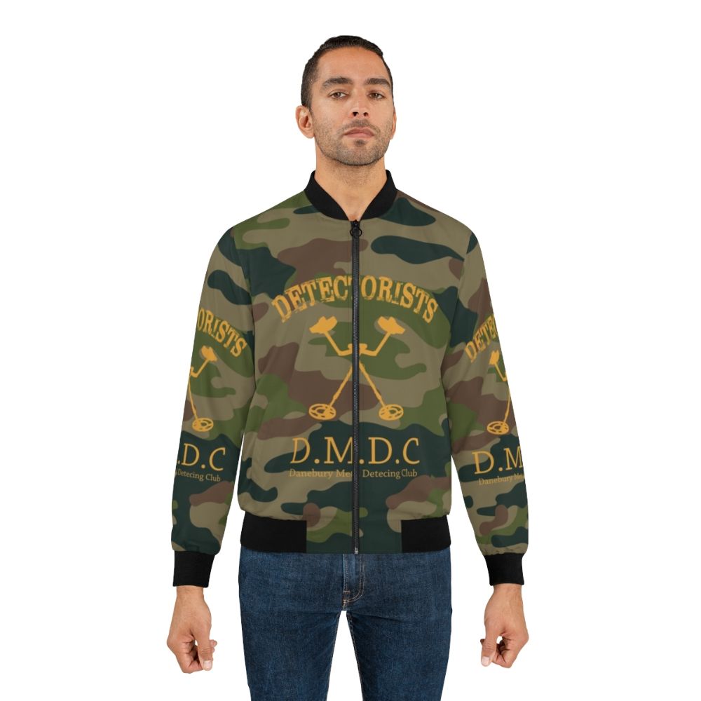 Detectorists Camo Bomber Jacket featuring the iconic Danebury Metal Detecting Club logo - Lifestyle