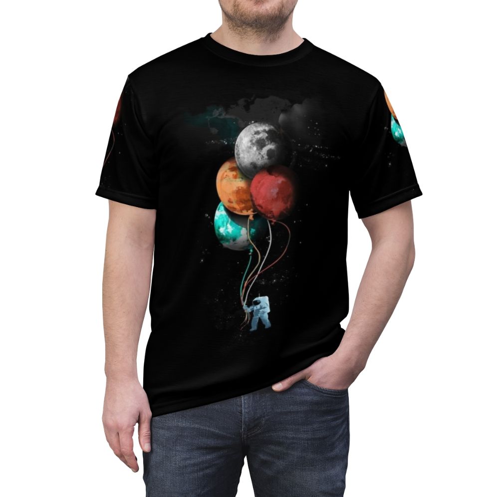 Cosmic Spaceman T-Shirt with a surreal, artsy space design featuring a spaceman, planets, and floating balloons - men front