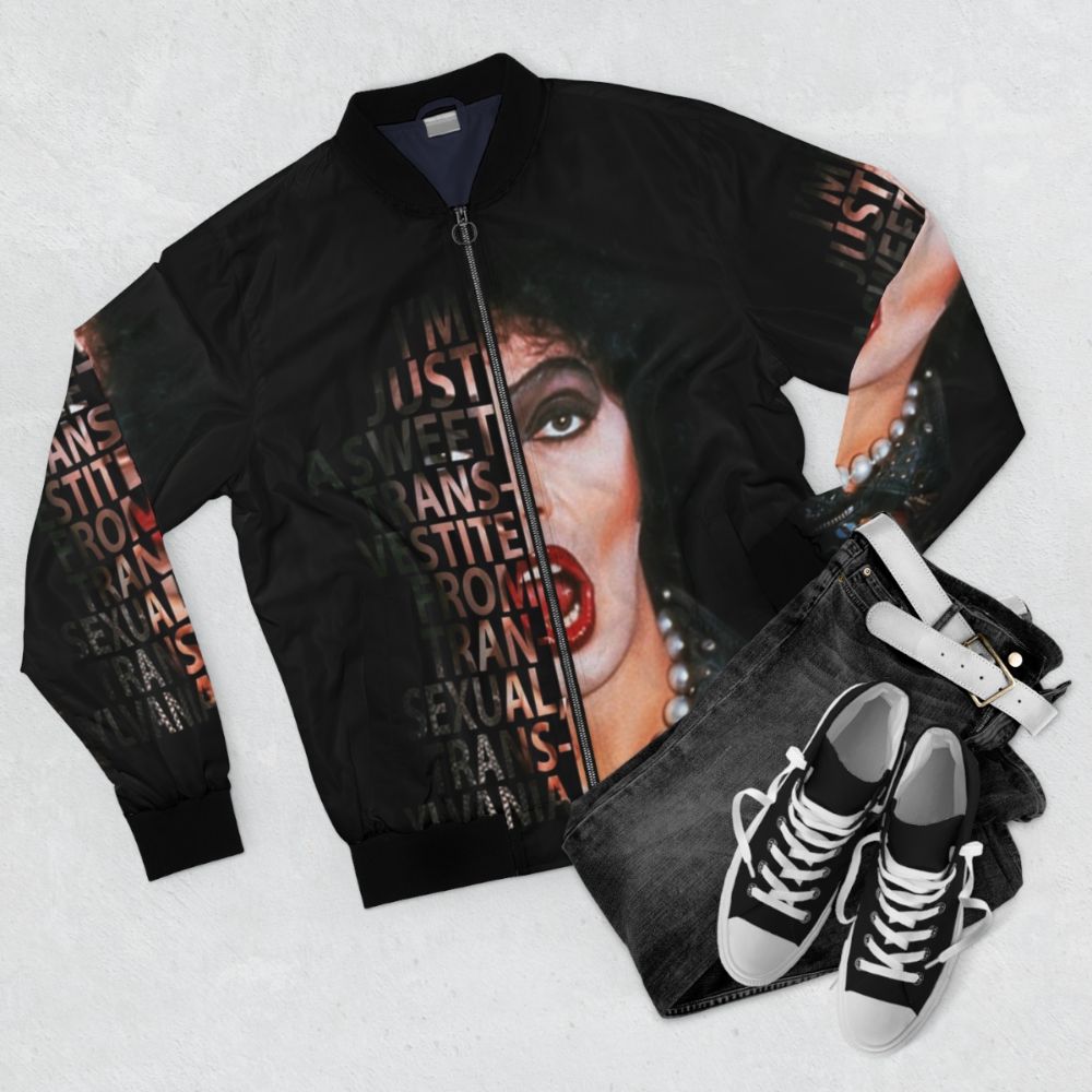 A stylish bomber jacket featuring the iconic Frank N Furter character from the Rocky Horror Picture Show. - Flat lay