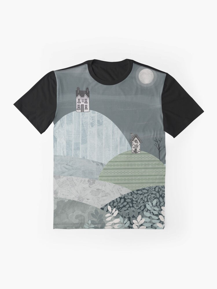 Cozy winter landscape graphic t-shirt featuring a village nestled in hills under a starry night sky - Flat lay