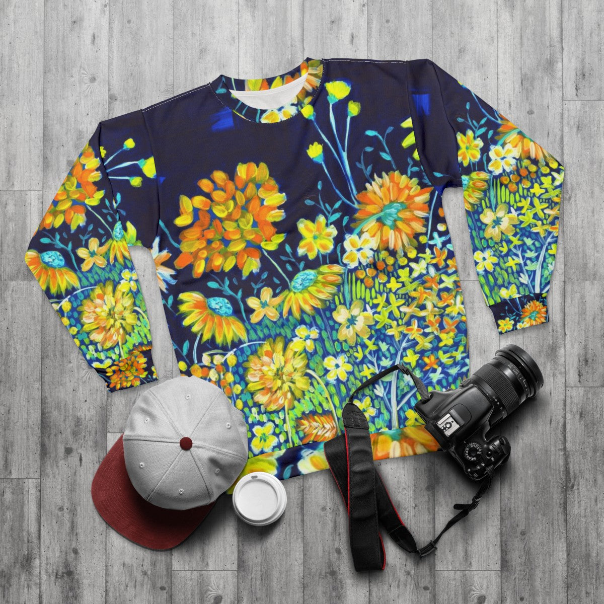 Vibrant spring night floral sweatshirt with indigo blue and yellow daisies - flat lay