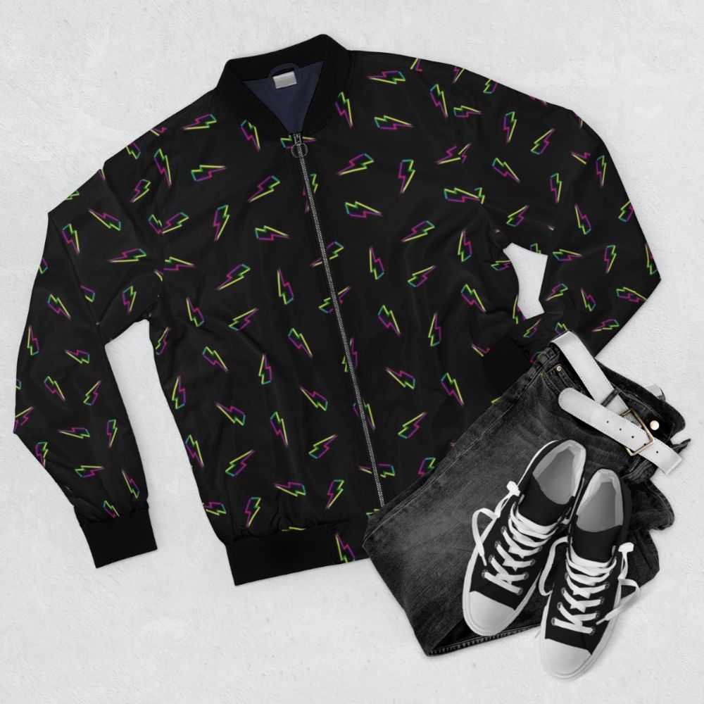 CMYK lightning bolt design on a black bomber jacket - Flat lay