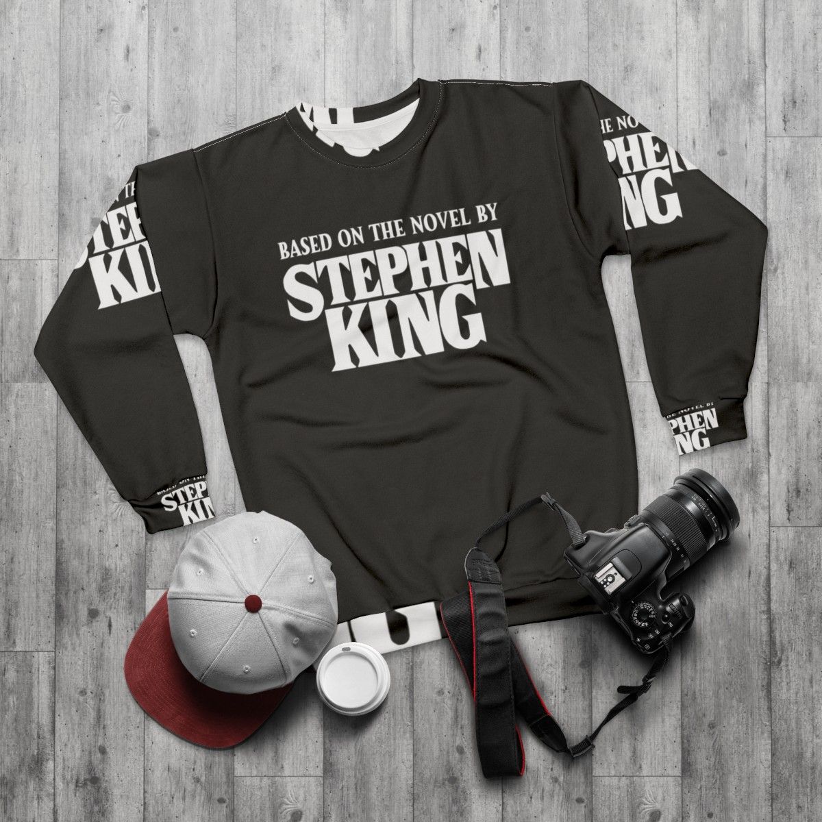 Stephen King-inspired horror sweatshirt featuring a graphic based on one of his acclaimed novels - flat lay