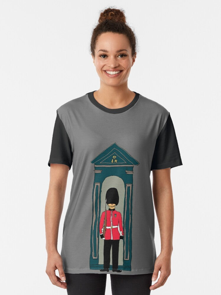 British Guardsman Graphic T-Shirt featuring a soldier wearing a bearskin hat and standing in a sentry box in front of Buckingham Palace, London, UK. - Women