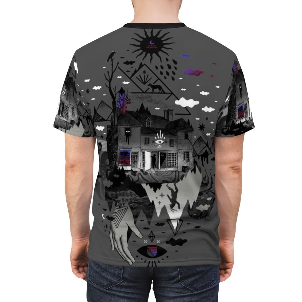 A surreal and abstract t-shirt design featuring a collage of dark mountain shapes, stars, moon, and other symbolic elements. - men back