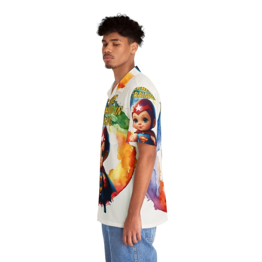 kid wearing blue hawaiian shirt with superhero graphic - People Left