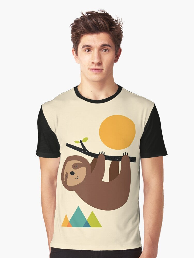 A graphic t-shirt design featuring a relaxed sloth in a natural landscape - Men