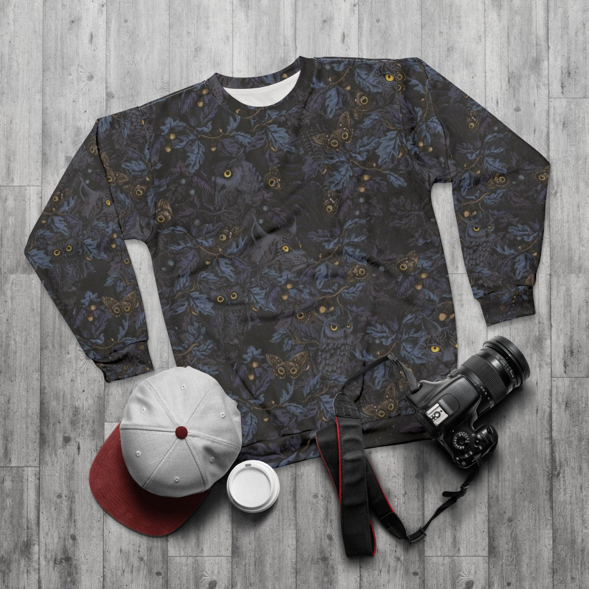 Moonlight blue sweatshirt with autumn leaves and camouflage pattern - flat lay