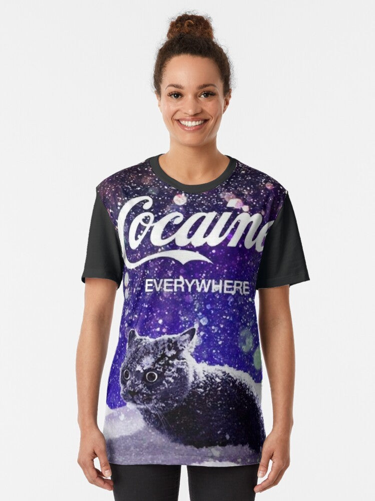 A graphic t-shirt design featuring a cat surrounded by snow and 'cocaine' written in a stylized text. - Women