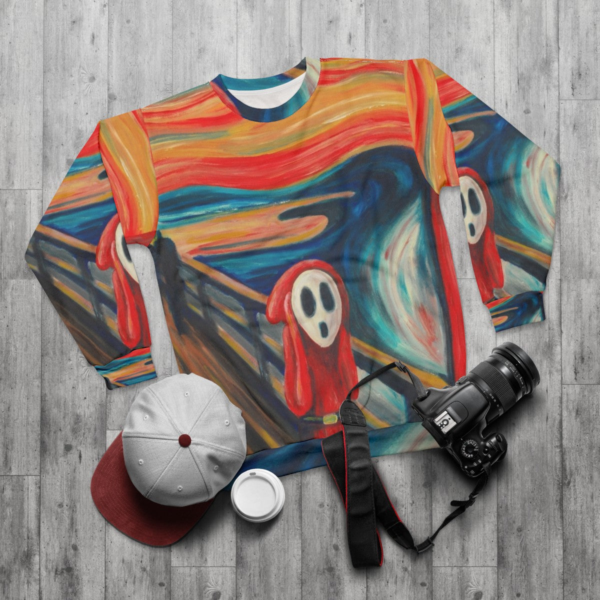 Edvard Munch's "The Scream" graphic on a cozy sweatshirt - flat lay