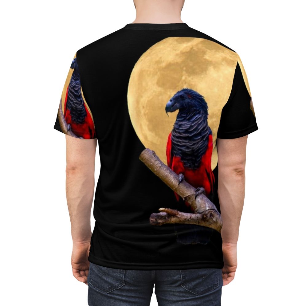 Illustration of a parrot wearing a Dracula costume against a crescent moon on a black t-shirt - men back