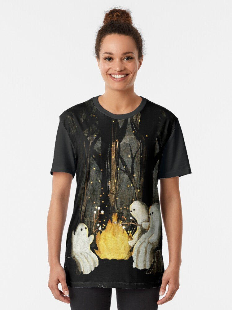 Graphic t-shirt featuring a campfire with marshmallows and a spooky ghost design - Women