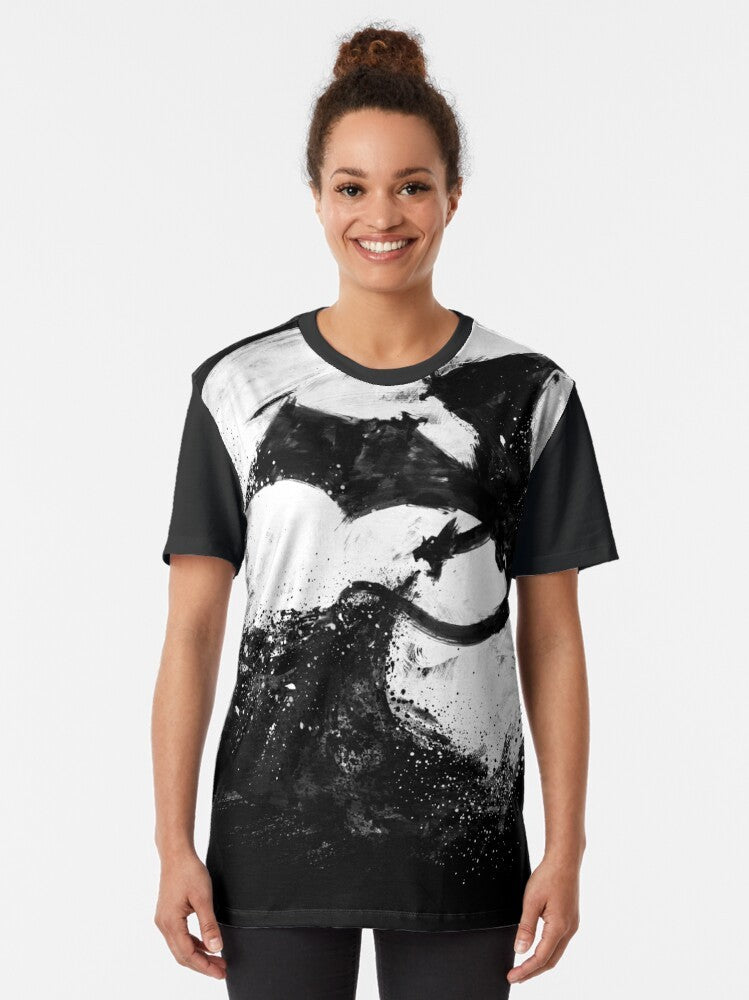 Midnight Desolation graphic t-shirt featuring a fantasy splatter design with a moon, dragon, and fire elements. - Women