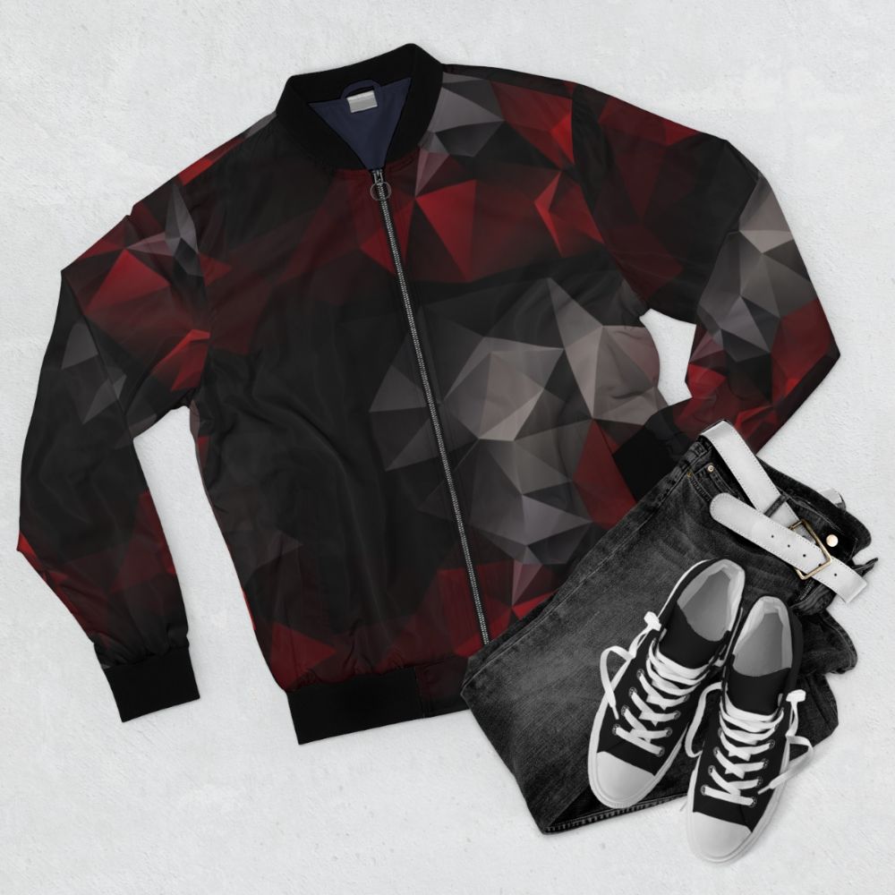 Abstract bomber jacket with a geometric triangles pattern in red and black colors - Flat lay