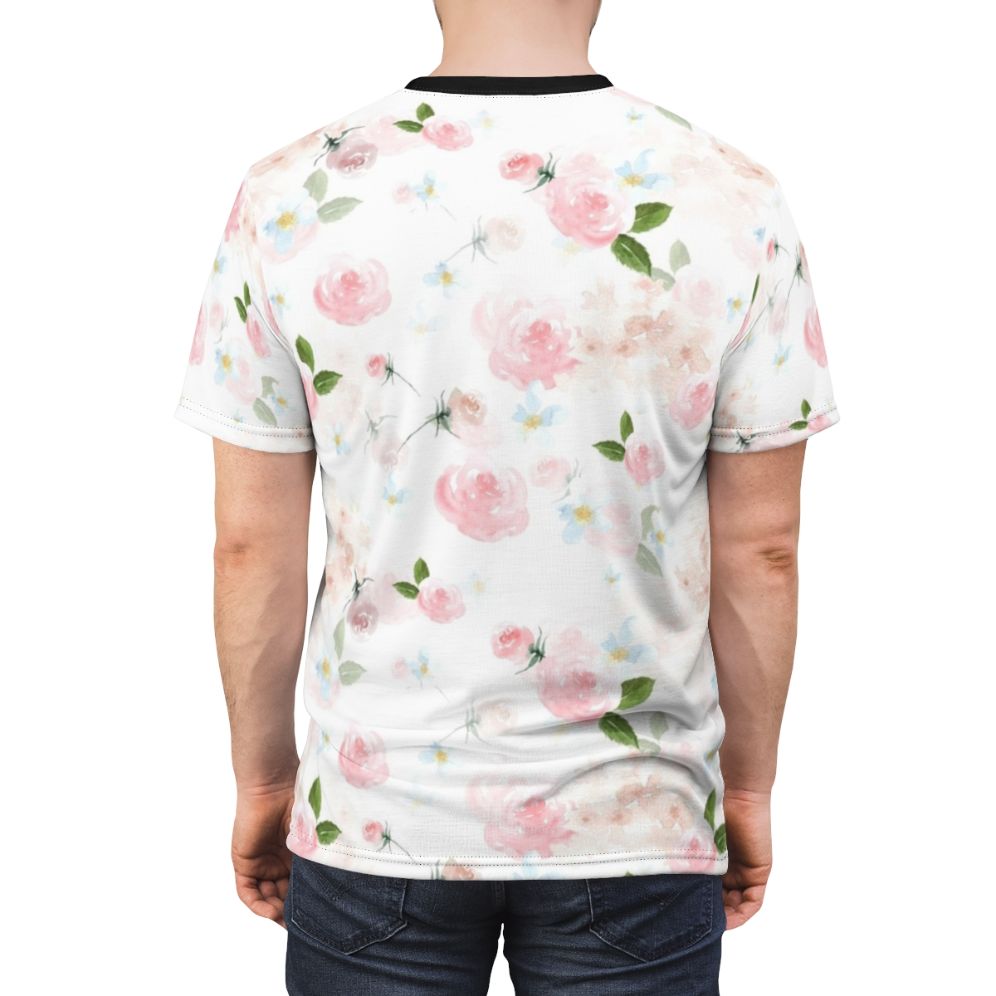 A close-up image of a blush pink floral botanical print design on a t-shirt. - men back