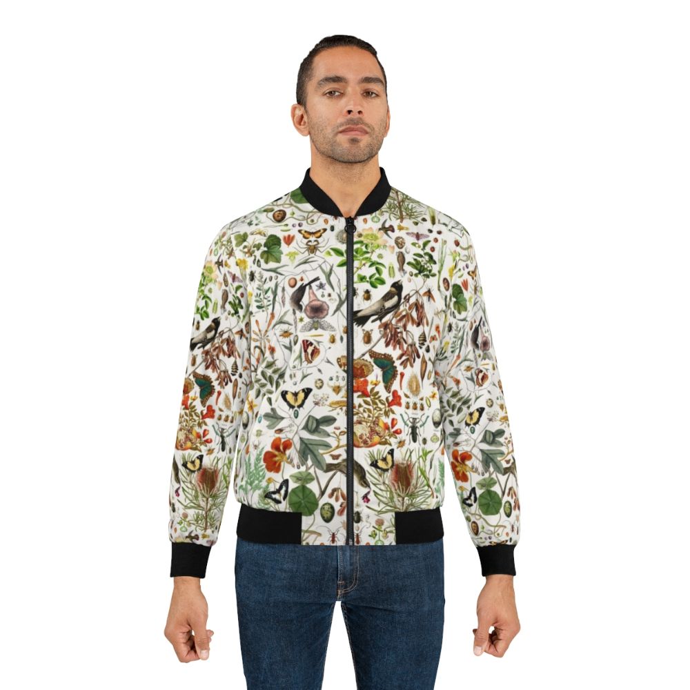 Vintage-style bomber jacket featuring a collage design of butterflies, birds, insects, and native Australian flora and fauna. - Lifestyle