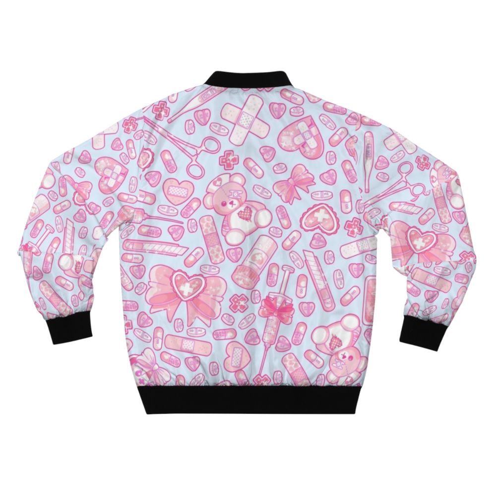 A pastel pink and white bomber jacket with a sickly sweet, creepy cute design featuring medical elements like pills and a hospital theme. - Back