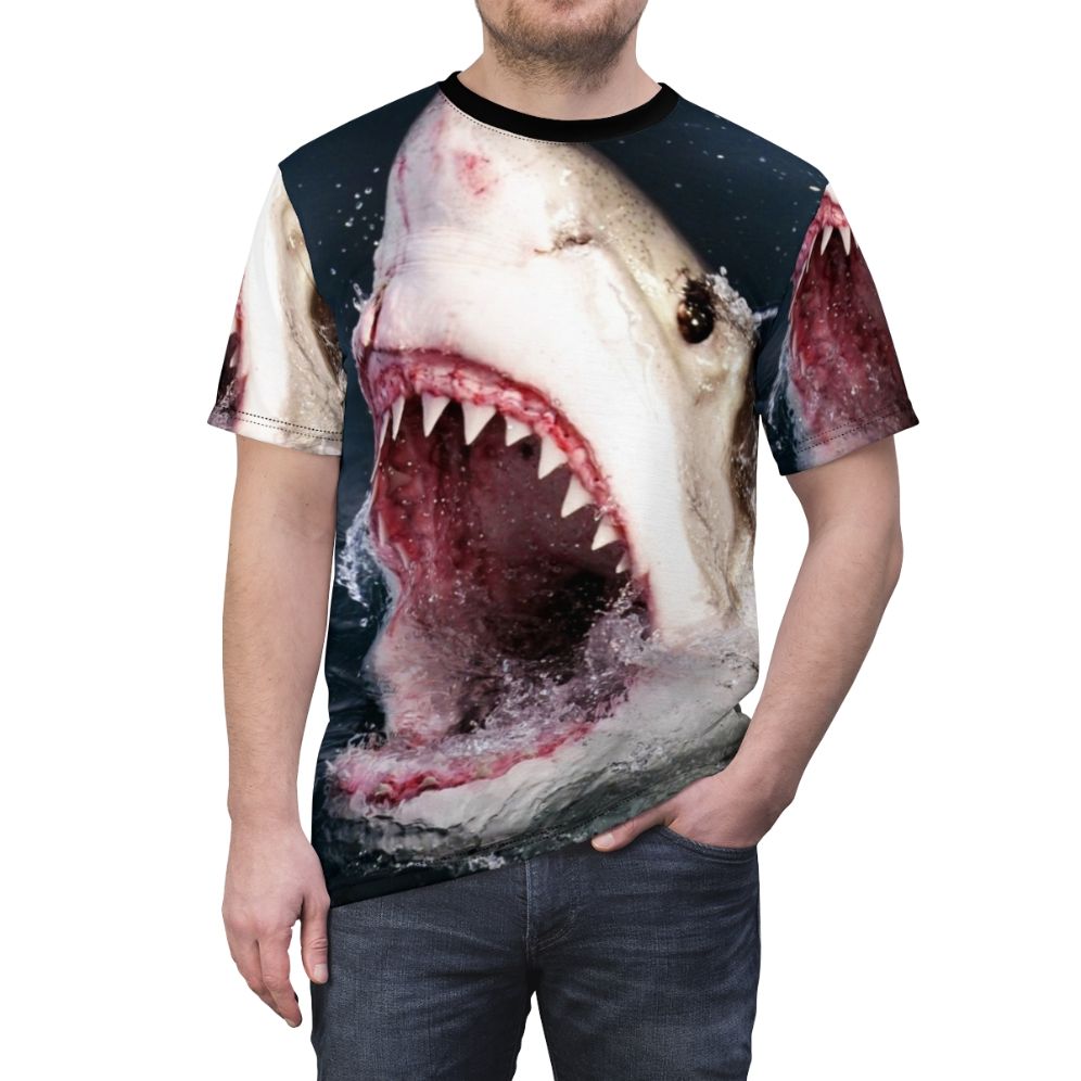 A realistic 3D graphic of a shark taking a bite out of a t-shirt on a solid background. - men front