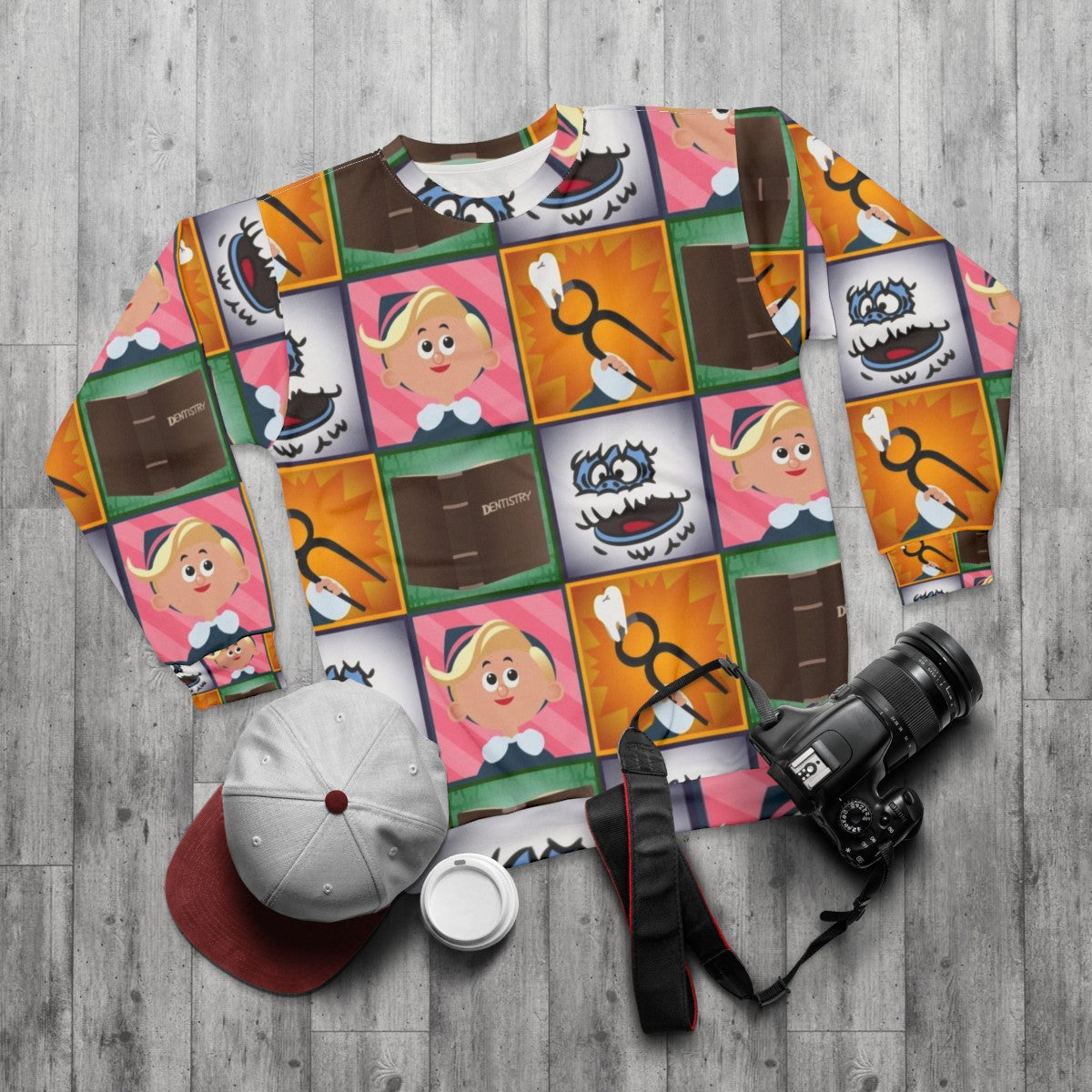 Hermey Square Christmas Sweatshirt with Rudolph the Red-Nosed Reindeer Inspired Design - flat lay