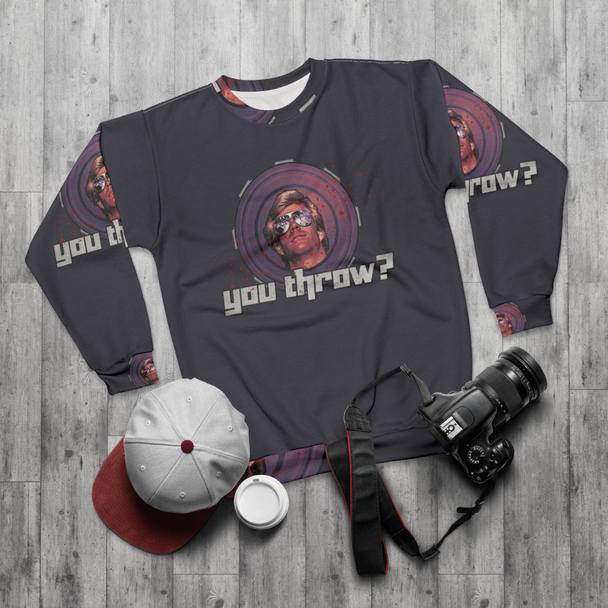 80s inspired "You Throw" sweatshirt with frisbee and action movie graphics - flat lay