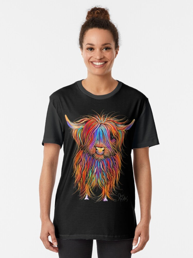 Graphic t-shirt featuring a hand-painted highland cow design by artist Shirley MacArthur. - Women