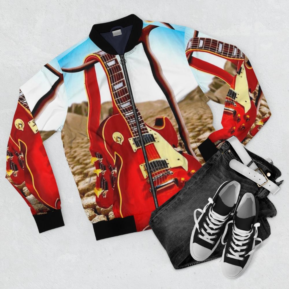 Vintage abstract bomber jacket with a surreal, psychedelic melted guitar and desert design. - Flat lay