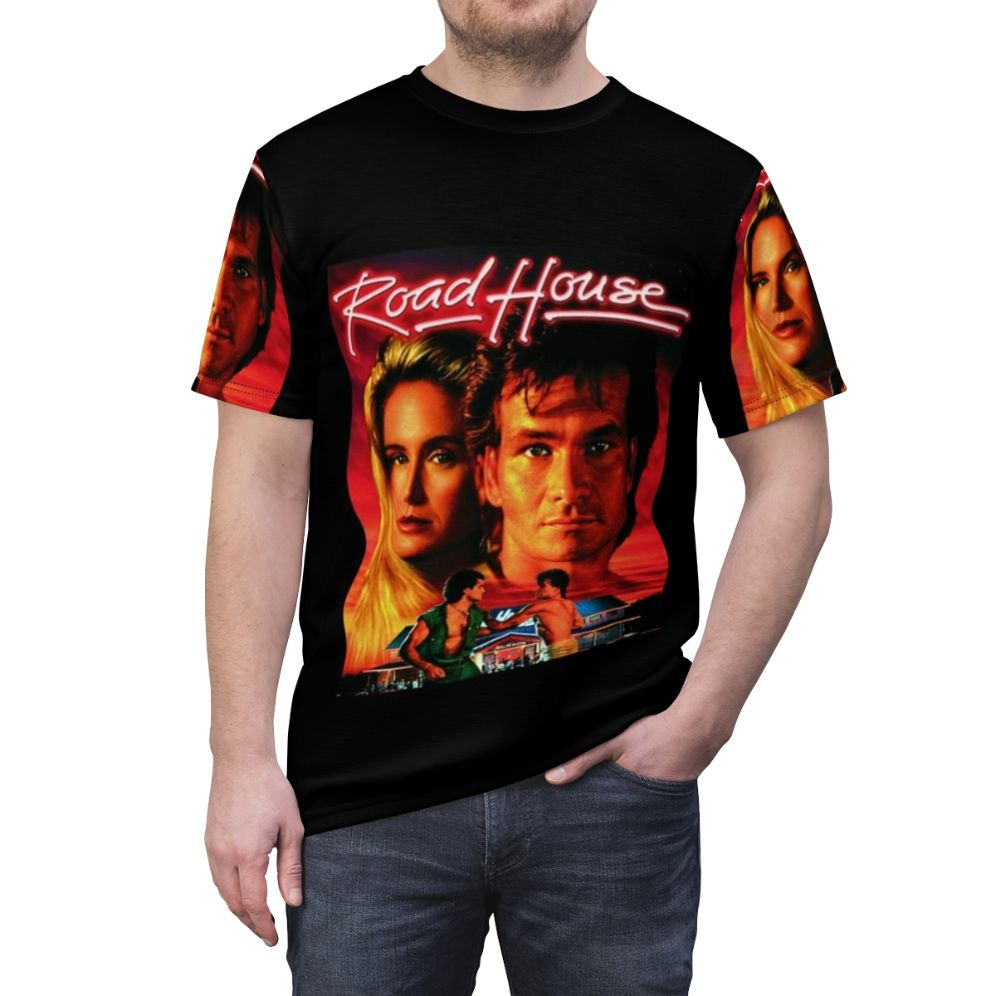 Retro-style t-shirt featuring the iconic "Roadhouse" movie logo and Patrick Swayze - men front