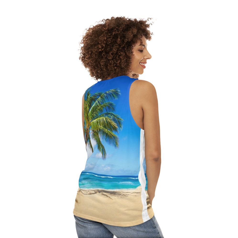 Unisex tank top with palm trees on a sandy beach in Hawaii - women back