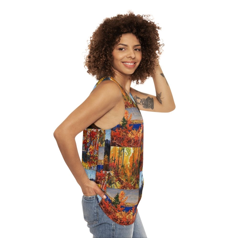 Unisex tank top featuring autumn foliage inspired by Canadian artist Tom Thomson - women side