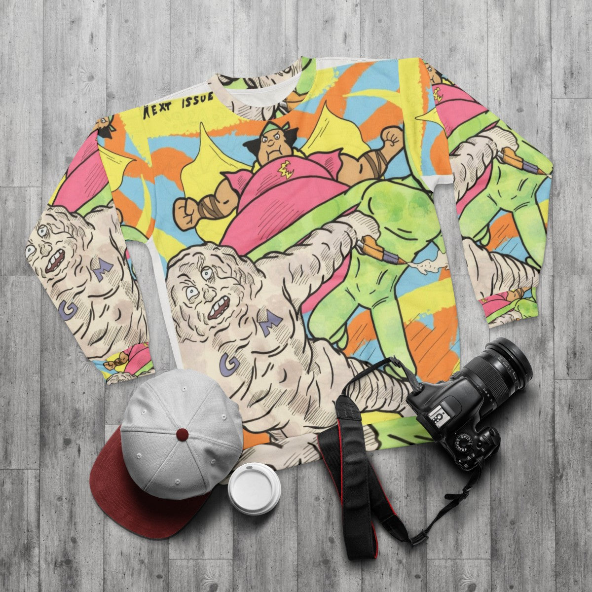 Cute Cloudman, Glueman, and Moon Alien superhero characters on a pastel sweatshirt - flat lay