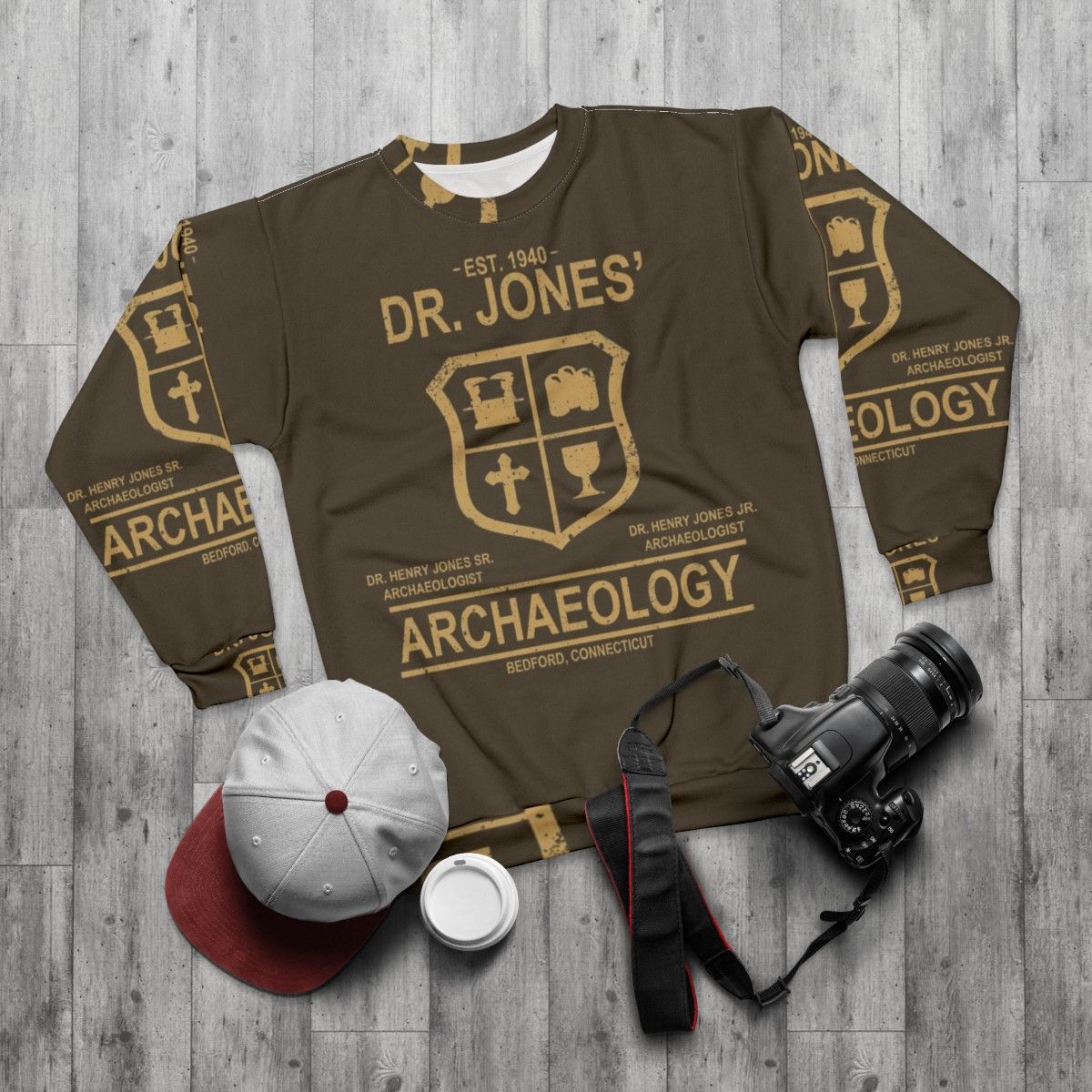 Archaeology-themed sweatshirt with Indiana Jones design - flat lay