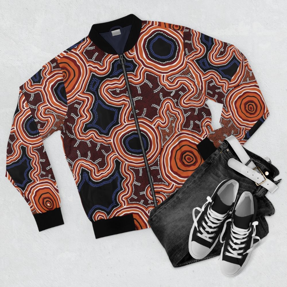 Authentic Aboriginal Art Bomber Jacket with Pathways to Water Design - Flat lay