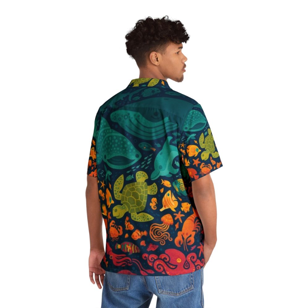 Colorful Hawaiian shirt with a spectrum of aquatic sea life - Flat lay