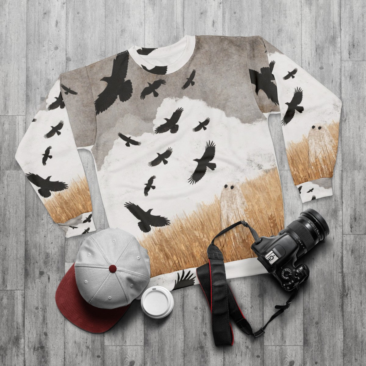 Vintage-style sweatshirt featuring crows and autumn imagery - flat lay