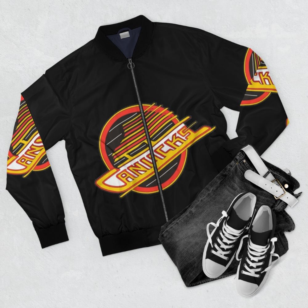 Vancouver Canucks retro hockey-themed bomber jacket featuring the team's iconic logo and colors - Flat lay