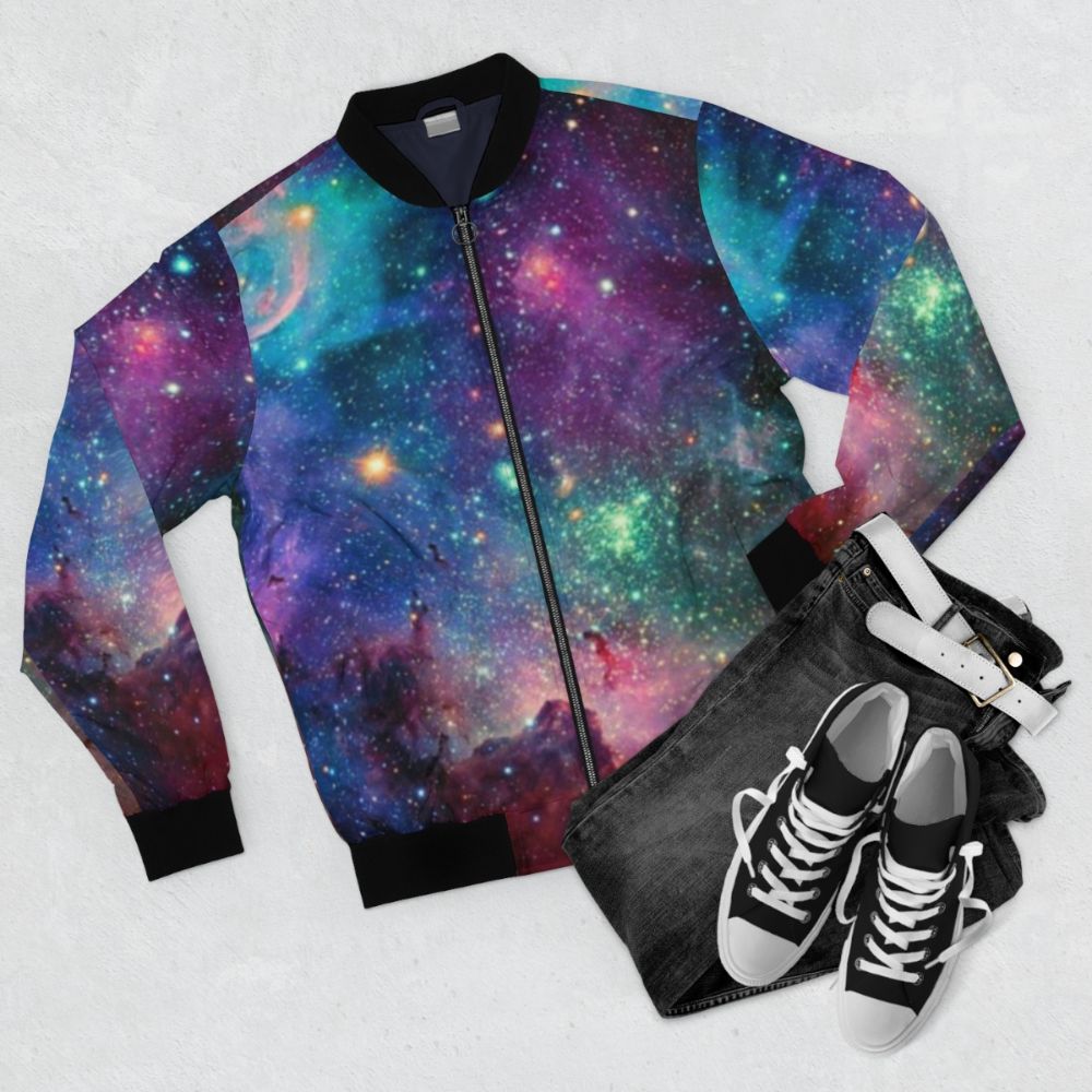 Galaxy bomber jacket featuring planets, stars, and cosmic patterns - Flat lay